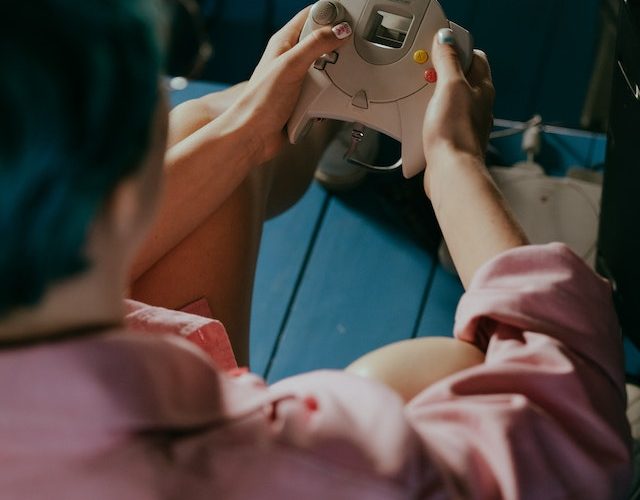 Photo by cottonbro studio: https://www.pexels.com/photo/man-in-pink-shirt-holding-gray-smartphone-4842577/