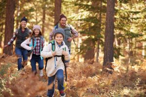 Family enjoying hike in a forest, California, USA