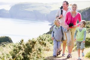 Happy family getting ready for road trip on a sunny day