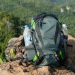 Man Traveler with backpack relaxing outdoor