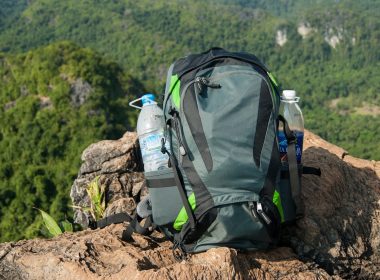 Man Traveler with backpack relaxing outdoor