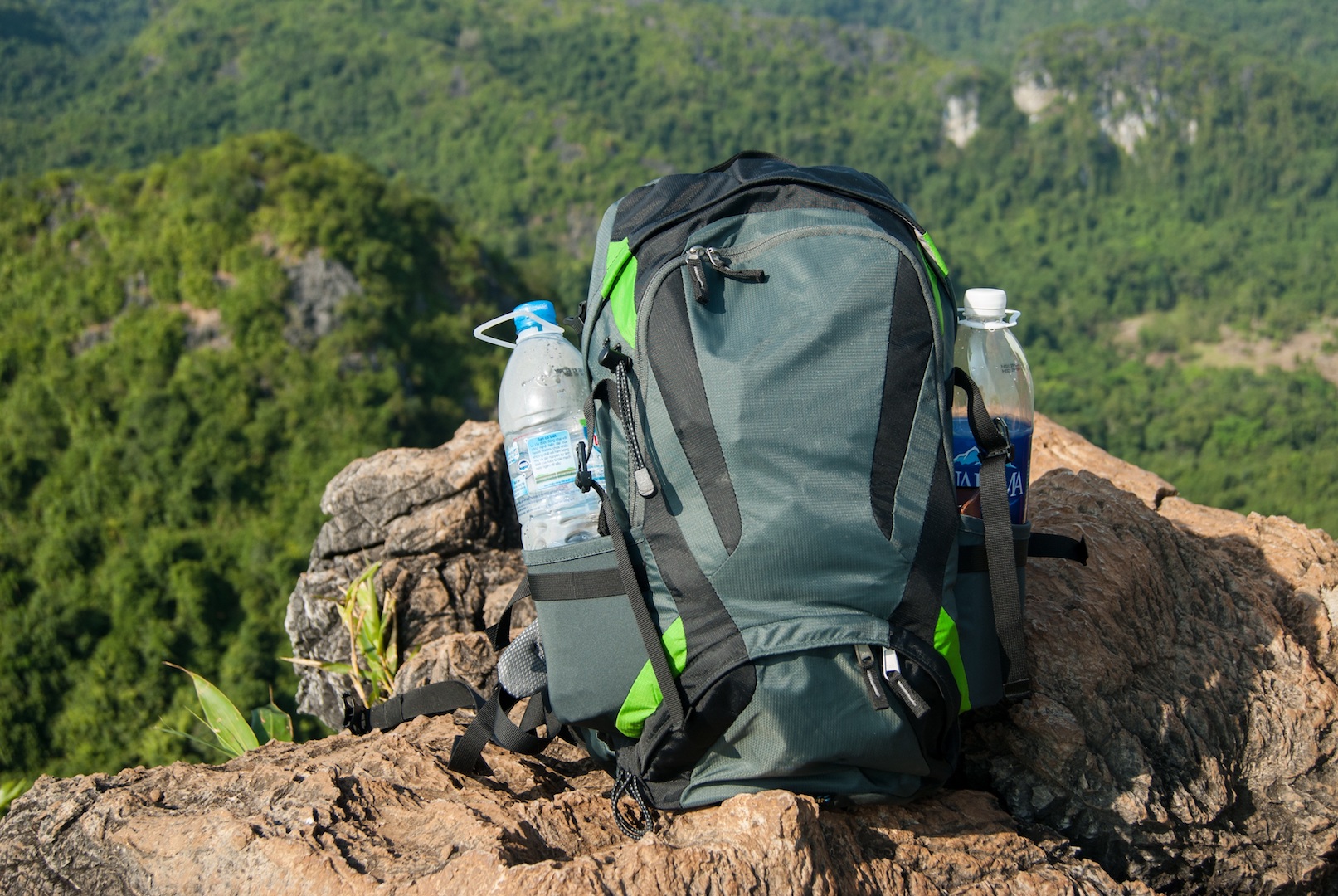 Man Traveler with backpack relaxing outdoor