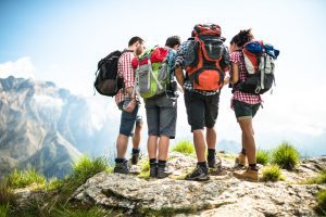 Man Traveler with backpack relaxing outdoor