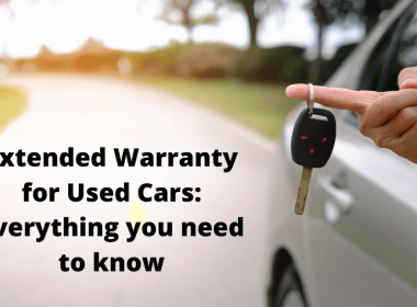 a person holding a key in their handCar Warranty and How Does It Work in Canada?