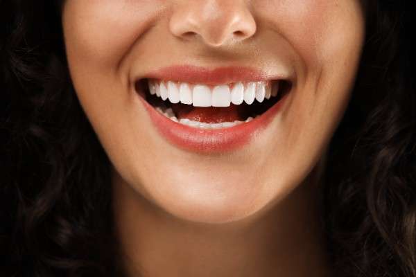 A radiant smile is often seen as a symbol of confidence, health, and vitality. For many, achieving whiter teeth is a top priority, yet the journey is not always without discomfort. One of the biggest concerns surrounding whitening treatments is tooth sensitivity, which can transform the excitement of achieving a brighter smile into a painful experience. The positive aspect is that, when approached correctly, achieving a brighter smile can be done without experiencing sensitivity. This blog explores causes, preventive measures, safe treatment options, and lifestyle adjustments that ensure lasting results. Understanding Tooth Sensitivity Tooth sensitivity occurs when the protective enamel wears down or gums recede, exposing the underlying dentin. This layer contains microscopic tubules that lead directly to the tooth’s nerve, making it vulnerable to sensations triggered by hot, cold, sweet, or acidic foods. When whitening agents penetrate enamel or irritate exposed dentin, sensitivity often follows. Some individuals naturally have thinner enamel, while others may develop sensitivity from lifestyle habits such as grinding teeth or frequent acidic food consumption. Understanding these underlying factors is the first step in managing and preventing discomfort during whitening treatments. Common Causes of Sensitivity During Whitening Tooth sensitivity during whitening procedures is not uncommon. The main triggers include: Overuse of Whitening Products – Frequent or prolonged use can erode enamel and irritate nerves. High Concentration of Bleaching Agents – Strong chemicals penetrate too deeply into enamel. Pre-Existing Dental Problems – Cavities, cracked teeth, or gum recession heighten sensitivity. Improper Application – At-home treatments applied without professional supervision can cause uneven results and discomfort. These factors highlight why professional assessment is crucial before pursuing any whitening procedure. Safer Whitening Options For those looking for effective yet gentle methods, there are safer alternatives to aggressive bleaching. 1. Professional Treatments Dentist-supervised treatments provide tailored care. A Dentist in Leicester can use advanced techniques and safe concentrations to minimise risks. These treatments may also include desensitising gels and customised trays for comfort. 2. Gentle At-Home Kits Dentists may recommend lower-concentration, at-home kits designed for gradual whitening. These are generally safer than over-the-counter products. 3. Whitening Toothpastes Specialised pastes can lighten stains over time using mild abrasives. While the results are not as dramatic, they are far less likely to cause sensitivity. Option Pros Cons Professional Treatments Fast results, customised care Higher cost Dentist-Approved Kits Convenient, gradual improvement Slower than professional methods Whitening Toothpastes Affordable, easy to use Limited effectiveness These alternatives balance effectiveness with comfort, making them appealing choices for those wary of sensitivity. Preventing Sensitivity Before Whitening Taking precautionary steps before whitening can significantly reduce the risk of discomfort. Book a Dental Check-Up – A Dentist in Leicester can detect cavities, enamel wear, or gum issues before treatment. Use Desensitising Toothpaste – Preparing teeth a few weeks in advance strengthens enamel and reduces nerve exposure. Strengthen with Fluoride – Fluoride rinses or gels create a protective barrier. Avoid Certain Foods – Limit acidic or sugary foods before treatment to prevent enamel weakening. Preparation is key in ensuring a smoother and more comfortable whitening journey. Managing Sensitivity During and After Whitening Even with precautions, some sensitivity may still occur. Thankfully, it can be managed effectively with small adjustments: Take breaks between whitening sessions to allow enamel to recover. Apply fluoride gels or varnishes for extra protection. Switch to a softer toothbrush and non-abrasive toothpaste. Avoid extreme hot or cold foods and drinks for a few days post-treatment. These strategies not only manage sensitivity but also help preserve whitening results. Natural Alternatives for Gentle Whitening For those who prefer a softer approach, natural options may provide gradual results with minimal risk. Baking Soda-Based Toothpaste – Acts as a mild abrasive to polish away surface stains. Oil Pulling – Swishing coconut oil in the mouth may reduce bacteria and surface discolouration. Crunchy Fruits and Vegetables – Apples, celery, and carrots act as natural stain removers while stimulating saliva production. Diet Adjustments – Reducing stain-causing foods such as coffee and red wine helps maintain a naturally brighter smile. While these methods are slower, they are suitable for individuals concerned about sensitivity. Video link : Affordable Teeth Whitening in Leicester – Check Prices & Options! The Role of Professional Guidance in Safe Whitening While at-home treatments are convenient, consulting a dental professional ensures safety and effectiveness. Professional oversight reduces risks of enamel damage and sensitivity. Key points: Customised treatment plans based on oral health. Appropriate strength of whitening agents for individual teeth. Guidance on frequency and duration to prevent overuse. Early detection of cavities, gum issues, or enamel erosion. Access to desensitising gels and protective trays. By combining professional advice with safe practices, patients can achieve brighter teeth while minimising discomfort. A Dentist in Leicester ensures treatments are both effective and tailored for lasting results. Maintaining Whitening Results Through Diet and Habits Long-term results depend not only on treatments but also on daily habits. Mindful dietary choices and oral hygiene practices can prevent staining and prolong the effects of Teeth whitening Leicester. Effective strategies include: Limiting coffee, tea, red wine, and acidic foods. Consuming crisp fruits and vegetables that help naturally clean and polish your teeth. Rinsing with water after meals to remove residue. Avoiding smoking and tobacco products. Consistently brushing with fluoride toothpaste and flossing to help prevent plaque buildup. By following these habits, patients maintain a whiter smile and reduce the need for frequent whitening sessions. Lifestyle Habits for Maintaining a Brighter Smile After reaching the preferred level of whiteness, it’s important to keep it consistent. Daily habits make a significant difference: Brush twice daily with fluoride toothpaste. Floss regularly to remove plaque build-up. Quit smoking, as tobacco is a major cause of staining. Rinse with water after meals to wash away stain-causing particles. By incorporating these habits, results from Teeth whitening Leicester can last longer, reducing the need for repeated treatments. Conclusion A sparkling smile does not have to come with the discomfort of sensitivity. By understanding the causes, exploring safer options, and adopting preventive measures, anyone can enjoy a brighter, healthier smile with confidence. Whether you opt for professional treatments or natural alternatives, the key lies in balance, care, and consistency. For long-lasting results and personalised advice, consulting a dental professional is always the best step forward. With expert support and mindful lifestyle habits, achieving a radiant smile without sensitivity is entirely possible, and easily maintained in Leicester.
