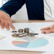 How do business loans help firms cover sudden cash flow gaps