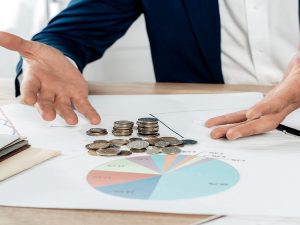 How do business loans help firms cover sudden cash flow gaps